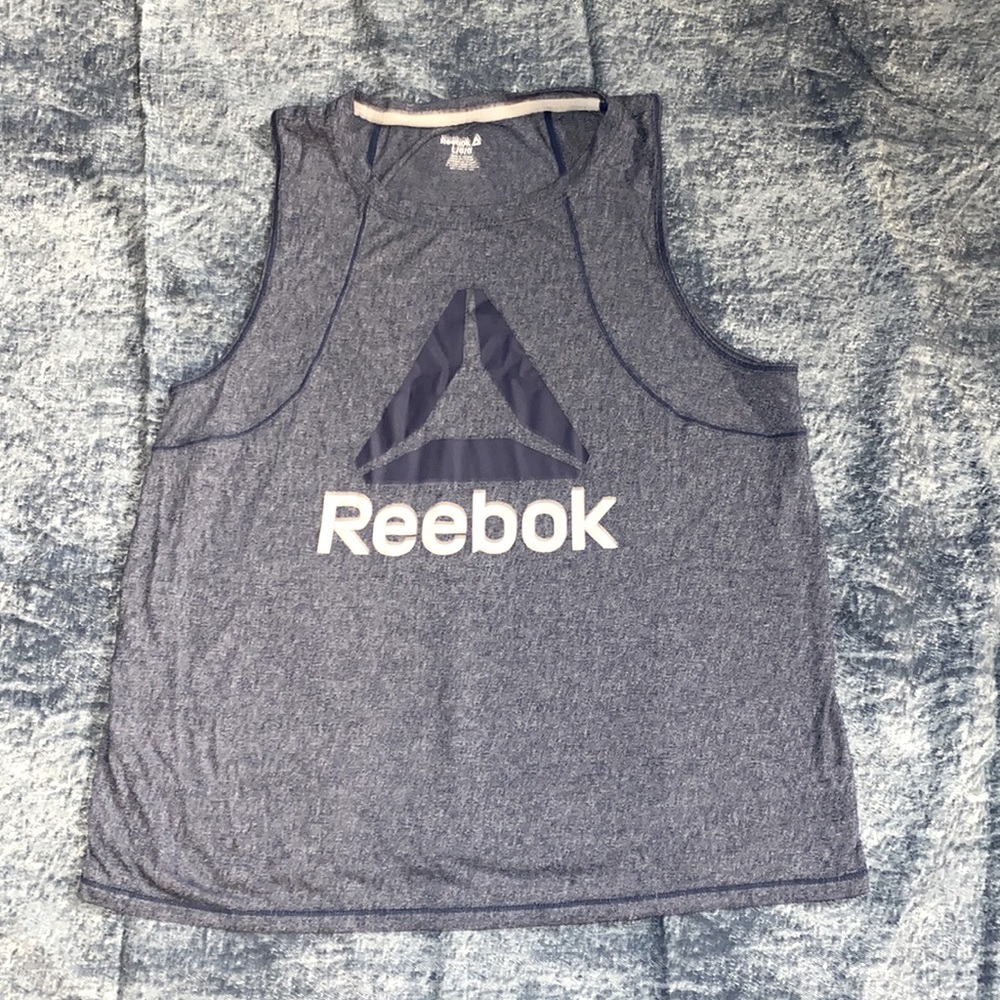 Navy blue and white Reebok tank. Made great for working out or lounging !